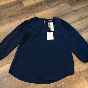 Navy long sleeve top with floral embroidery and back keyhole